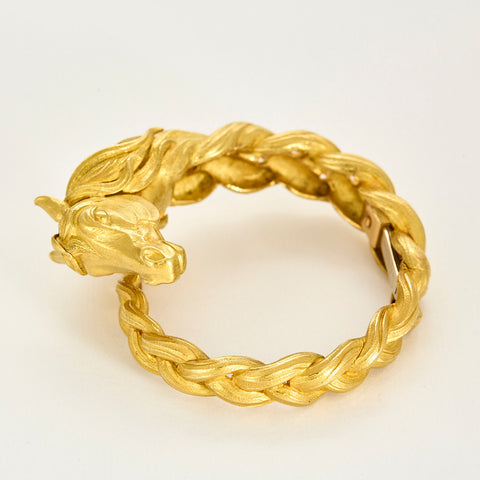 HERMES - Bracelet jonc en or jaune a motif de cheval